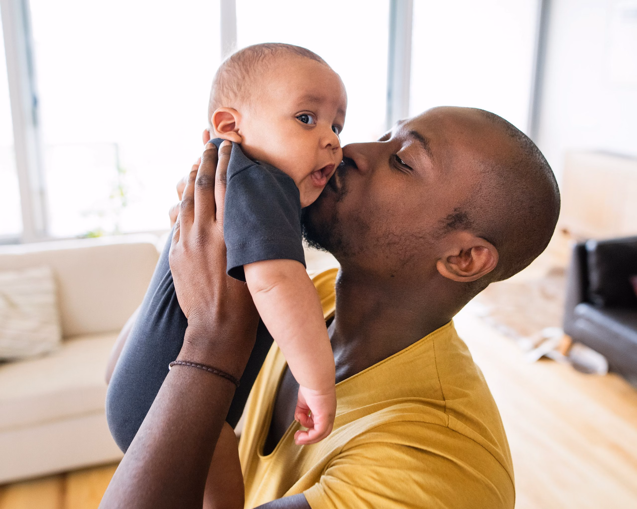 Dad Holding Up Baby Boy