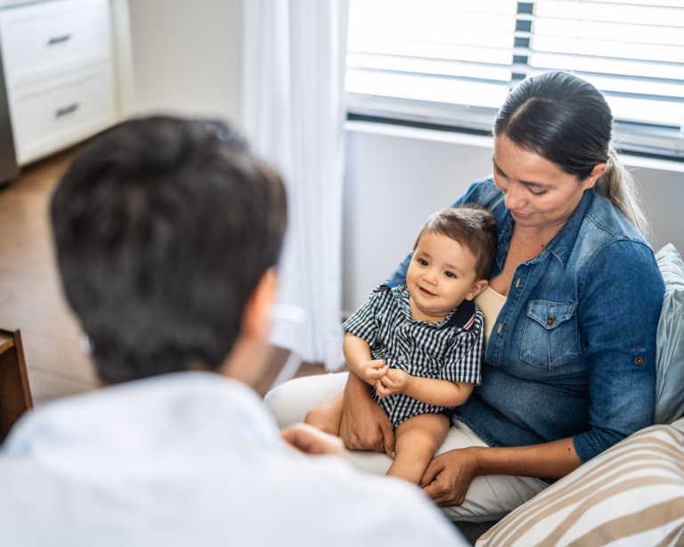 Mother With Son In Doctors Office