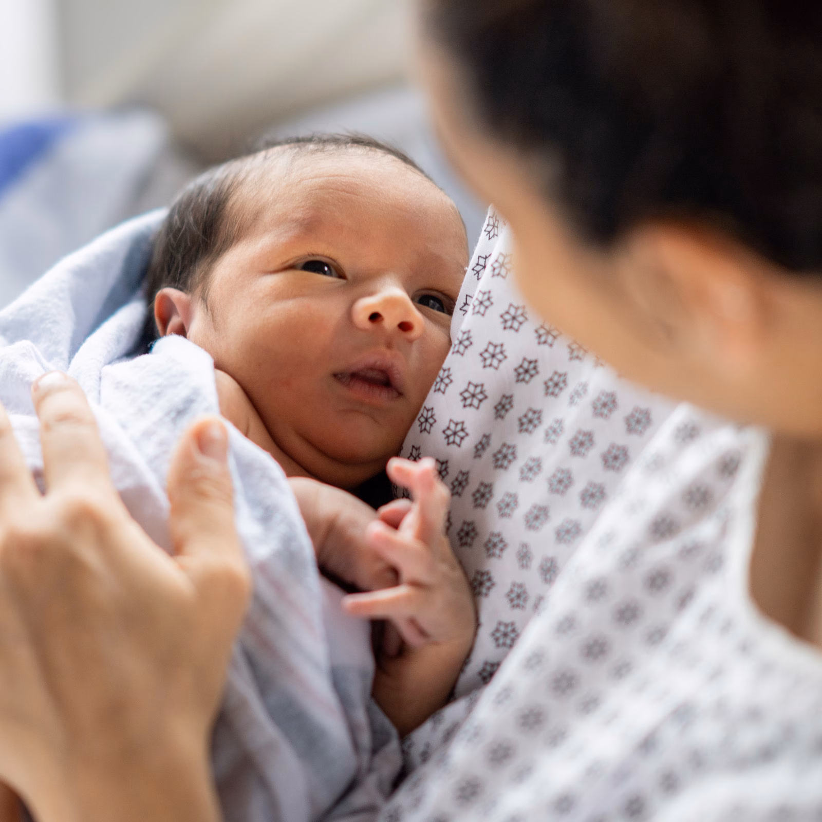 Woman Holding Newborn Baby